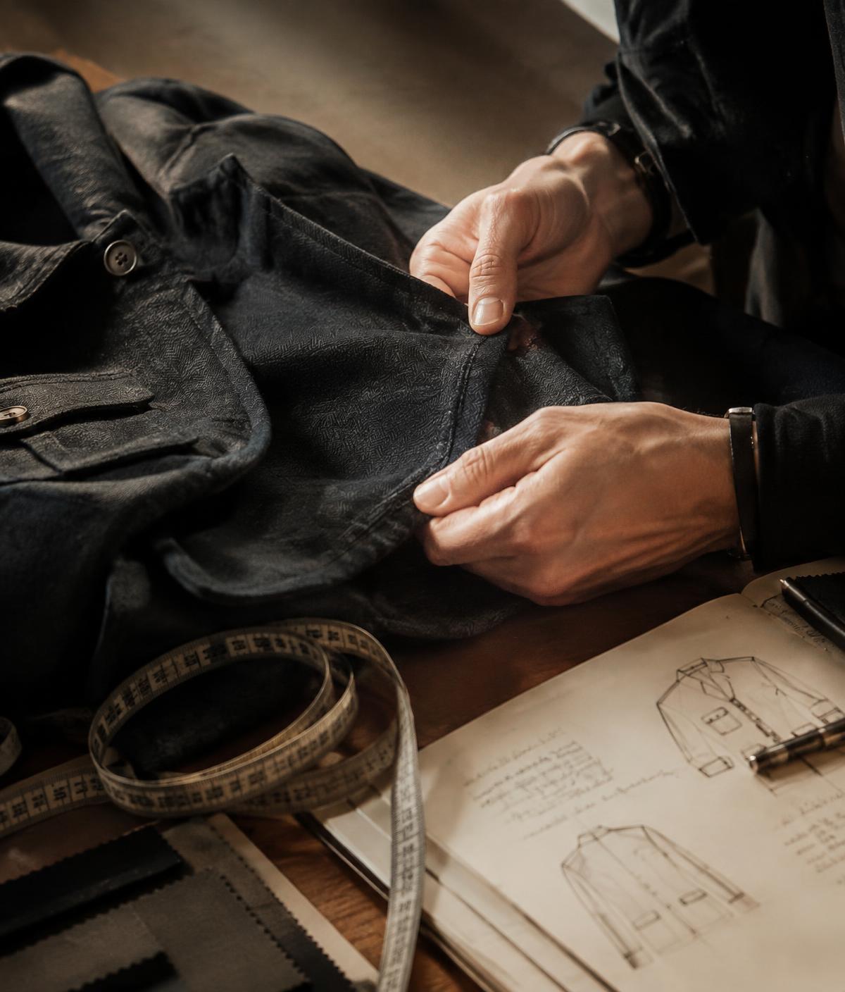 Expert inspecting garment construction and seam quality